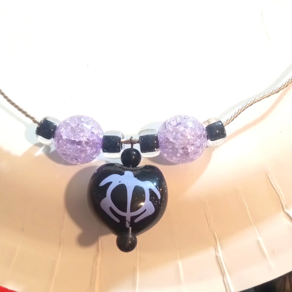 Hand crafted turtle necklace by Colorful Creations.